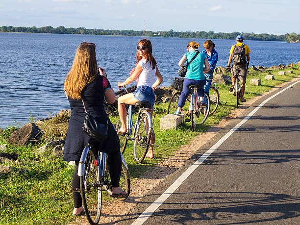 On nice, beautiful day a group of tourists with bicycles having fun at the